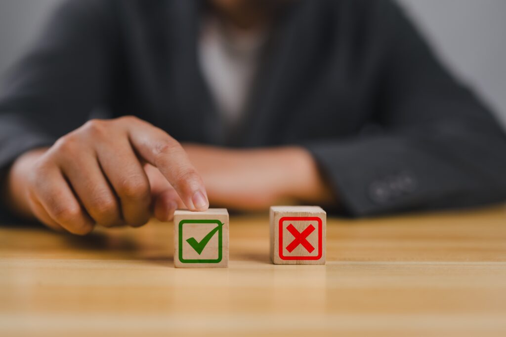 Person making a yes or no decision represented by check and X blocks