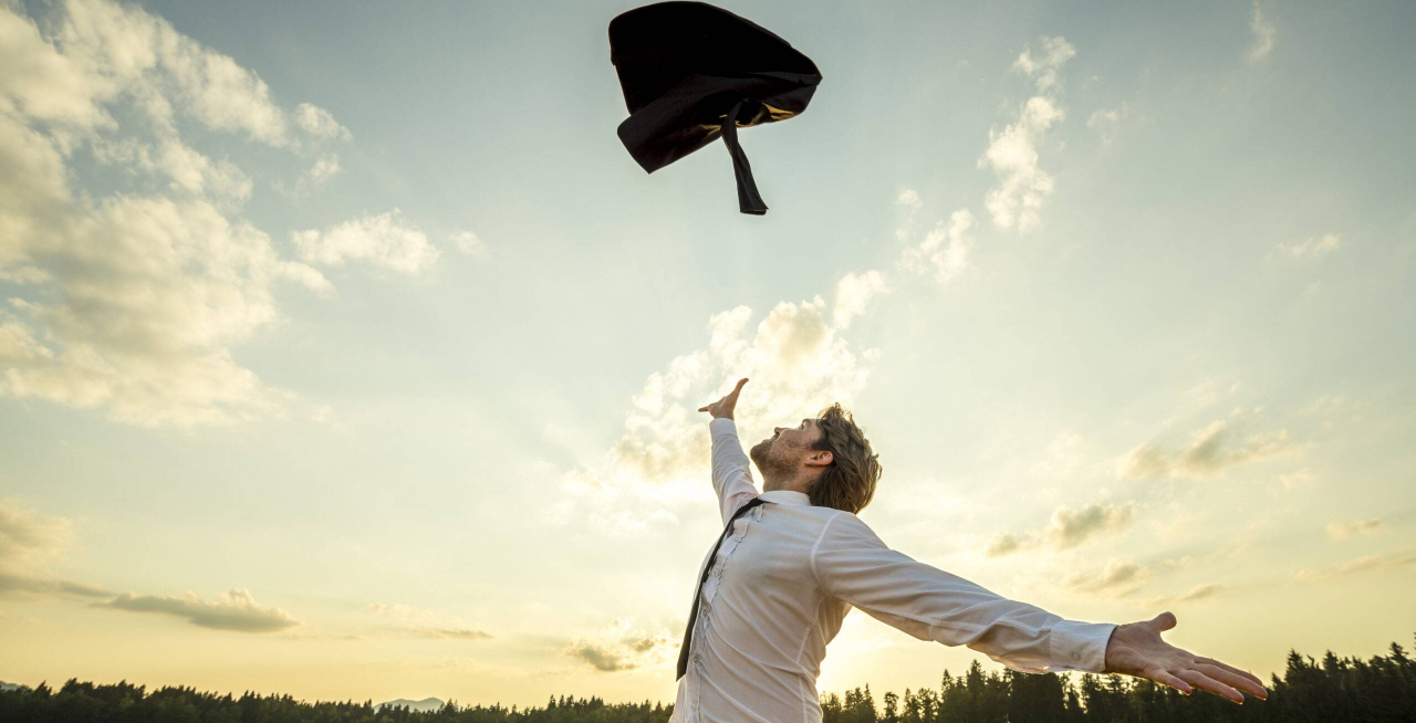 Happy,Successful,Young,Businessman,Throwing,His,Coat,In,The,Air