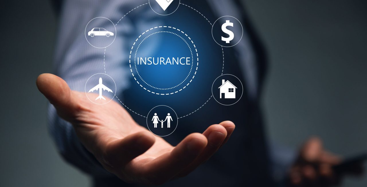 young-man-holding-phone-with-insurance-icon